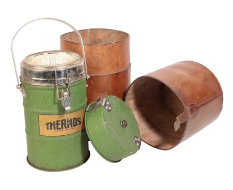 AN EDWARDIAN LEATHER THERMOS FLASK CARRIER with leather carrying handle, containing a Thermos,  35cm high