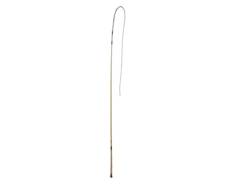 A GIG WHIP, late 19th century, with ivorine grip, nickel silver engraved collar and butt, with white malacca shaft and thong,