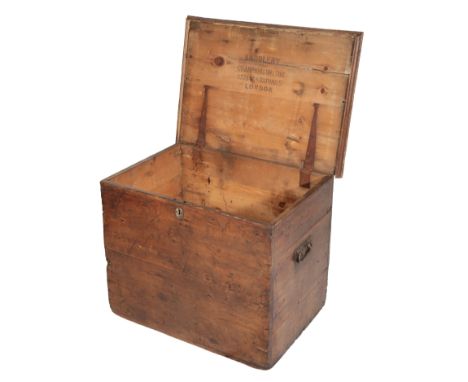 A VICTORIAN STAINED PINE TACK/BLANKET TRUNK with cast iron carrying handle and brass lock, with stencilled makers details to 