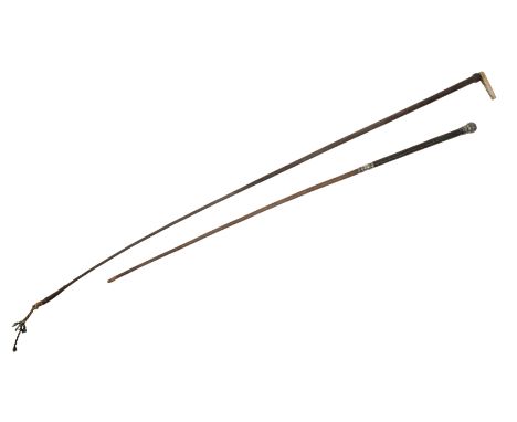 A VICTORIAN LADY'S SIDE SADDLE WHIP with white metal mount and grip; and another lady's side saddle whip with bone handle (2)