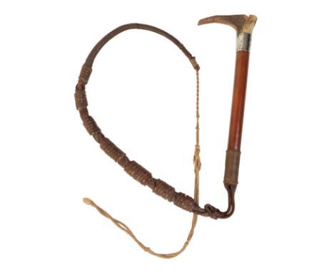 A BEAGLING WHIP with a whistle top, the malacca shaft with antler handle, silver collar and leather plaited thong, 24cm long