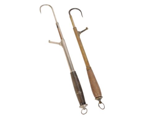 A RARE NICKEL SILVER EXTENDABLE FISHING GAFF with turned wooden handle; and an Army &amp; Navy Stores brass telescopic gaff w