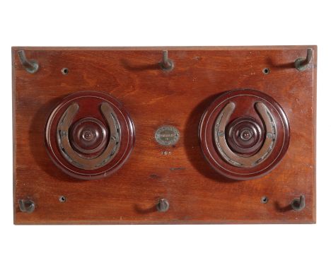 A VICTORIAN MAHOGANY DOUBLE WHIP REEL RACK with six brass whip hooks, on a mahogany backboard, brass plaque inscribed "Hampso