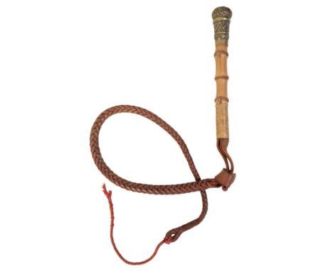 AN EDWARDIAN BEAGLING WHIP with a ribbed bamboo shaft, nickel silver collar and plaited leather thong, 21cm long