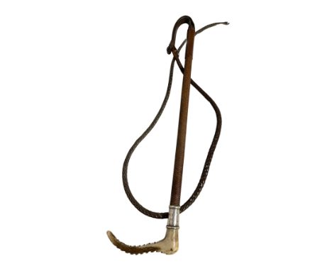 COOK &amp; SONS, LONDON: A GENTLEMAN'S HUNTING WHIP with cord platted shaft and leather plaited thong, antler handle and silv
