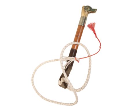 AN EDWARDIAN BEAGLING WHIP with a carved bone hounds head whistle and nickel silver collar, the malacca shaft with leather pl