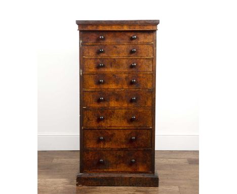 Walnut Wellington chest19th Century, fitted with eight drawers standing on a plinth base, 62cm wide x 127cm high x 41cm deepO