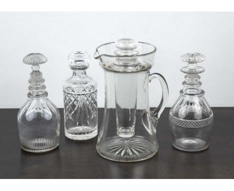 Collection of decantersincluding three decanters with lids and cut decoration, and a large glass lemonade jug or pitcher with