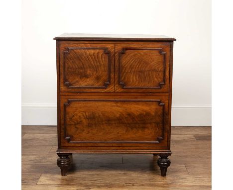 Mahogany commode with lift up top George III, the front with fielded panels, standing on turned tapering feet, 61cm wide x 73