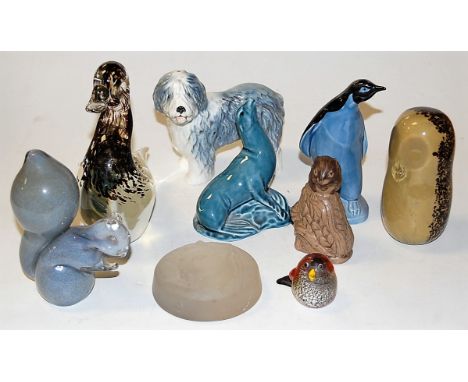 A small collection of assorted animal figures and paperweights, to include; Poole Pottery penguin, Mdina glass seahorse paper