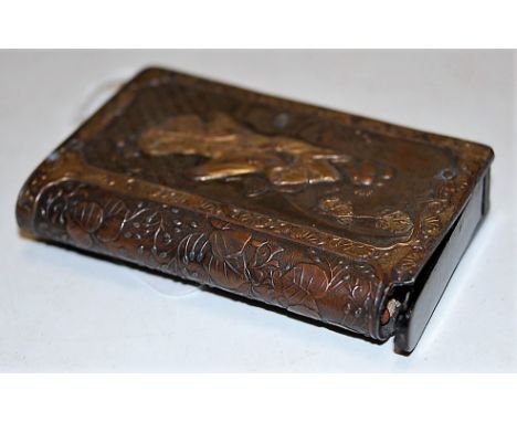 A Japanese Meiji period patinated copper vesta case, of book form, the obverse decorated in relief with storks, the reverse w