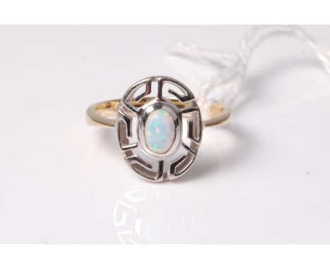 An opal cabochon ring, with Greek key style surround, to plain band stamped 585, size O, 2.7g