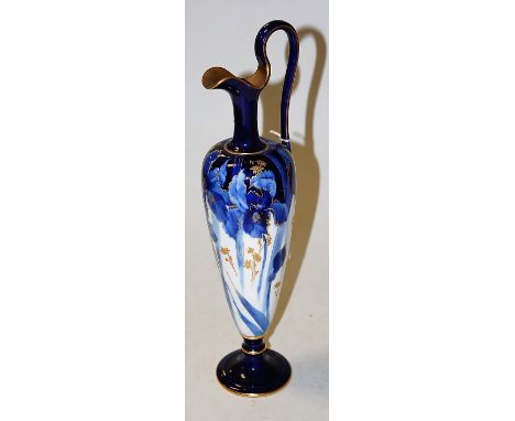 A Doulton Burslem ewer on a white ground with blue leaf decoration heightened in gilt, printed mark verso, numbered RA308?, h