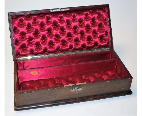 A circa 1900 leather clad and white metal mounted ladies dressing table box, the hinged lid revealing purple silk button back