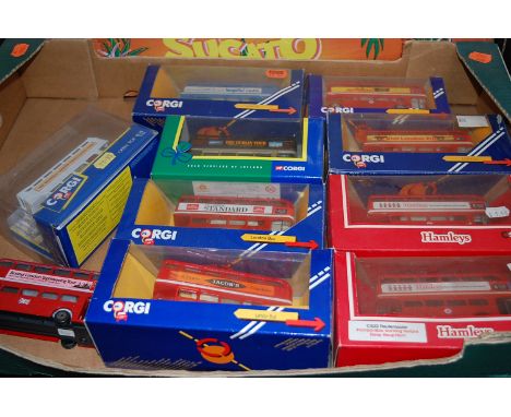 A box of various Corgi model buses 