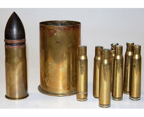 A late 19th century Continental brass shell case; together with various other spent ammunition 