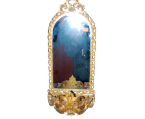 A gilt metal arched top wall mirror, having integral demi-lune plant trough