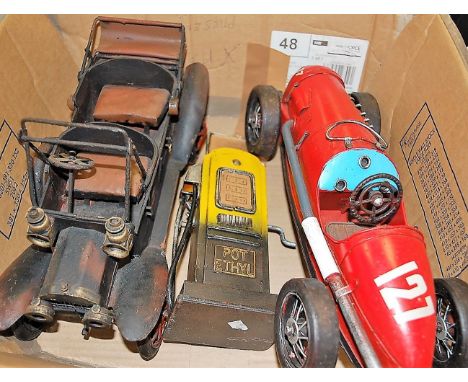 A painted metal model of a vintage racing car; together with a similar model of a vintage motor car; and a petrol pump (3)