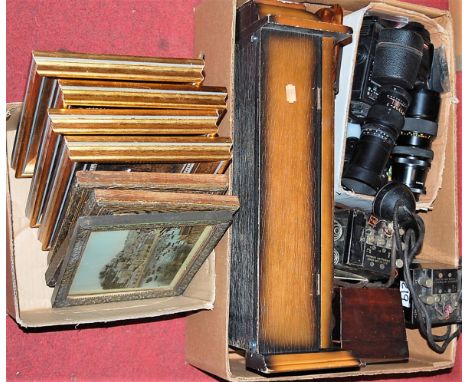 A box of mixed effects, to include; droptrunk wall clock, camera lenses, field telephone, tea caddy, hunting prints etc 