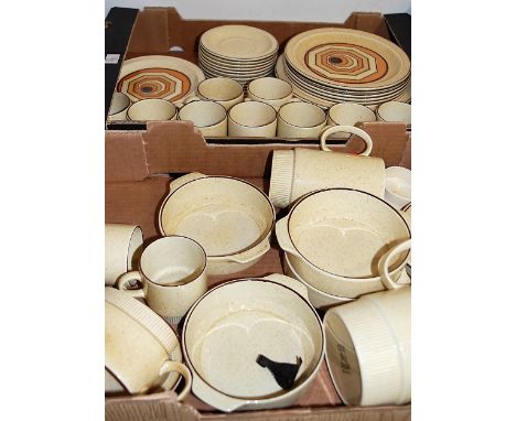 A modern Poole pottery Vortex pattern part tea and dinner service on a pale yellow ground with red flecked decoration