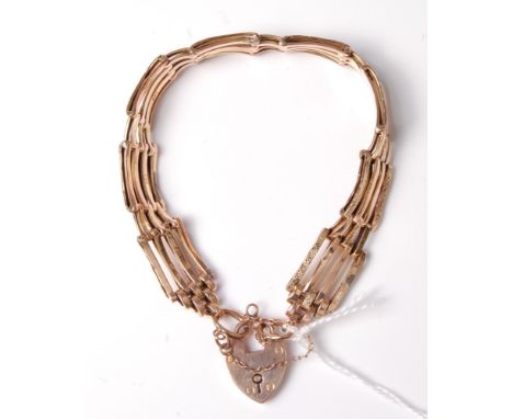 A 9ct gate link bracelet with heart shaped padlock clasp and safety chain, 12g