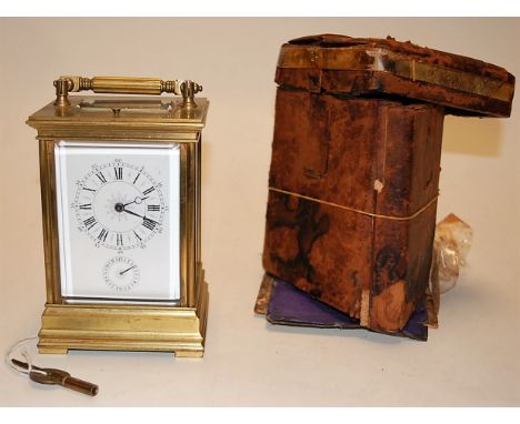 A circa 1900 French brass carriage clock, with alarm and push button hour repeat, having visible platform escapement, unsigne