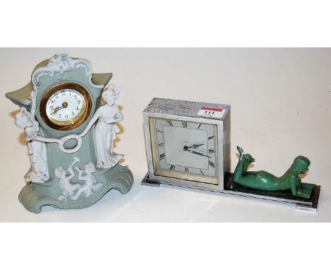 An Art Deco chrome cased mantel clock, having silvered dial with Roman numerals, surmounted by a reclining female nude; toget