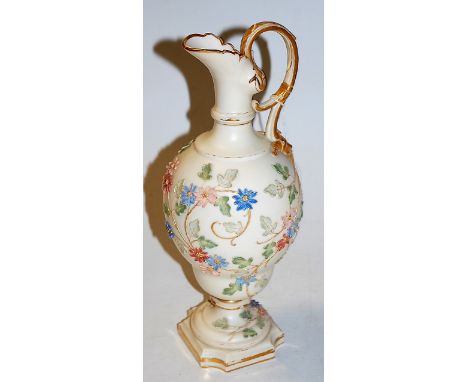 A circa 1900 Royal Worcester Chinaworks pedestal ewer, relief decorated with leaves and flowers, heightened in gilt, printed 