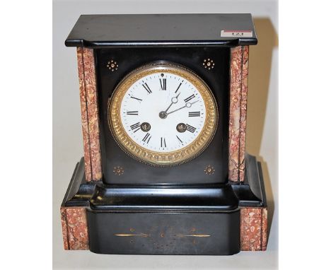 A late Victorian black slate and marble cased mantel clock, having enamelled dial with Roman numerals and eight day movement 