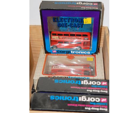 Five boxed Corgitronic model double-decker buses