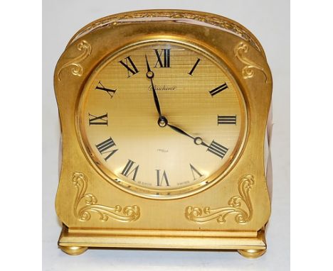 An early 20th century Bucherer gilt metal cased mantel clock having a signed dial with Roman numerals and 8 day, 15 jewel mov