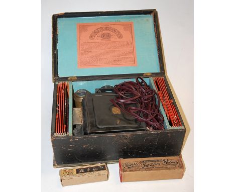 An early 20th century German magic lantern (boxed) with slides, together with two other boxes of magic lantern slides to incl