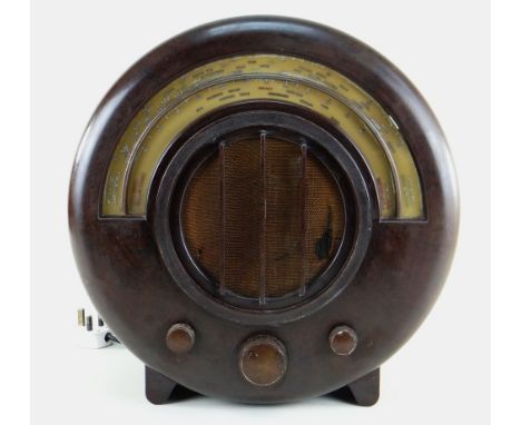 VINTAGE EKCO AD65 CIRCULAR BAKELITE RADIO, c. 1930s, designed by Wells Coates for E. K. Cole Ltd., 40cm high Condition: woven