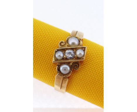 18CT GOLD PEARL &amp; DIAMOND RING of scroll and cross design having a central diamond (0.05cts approx.) and four pearls, rin