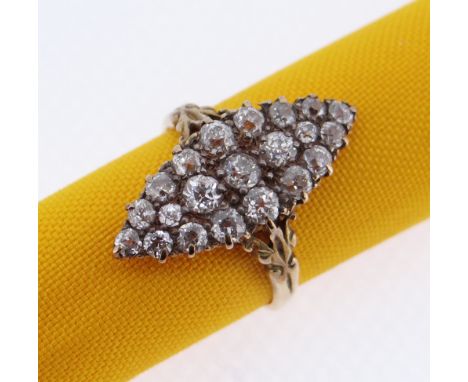 18CT GOLD MARQUISE DIAMOND ENCRUSTED RING, set with twenty-one old European cut diamonds of varying size, three central stone