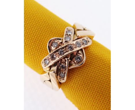 YELLOW METAL DIAMOND CROSS OVER RING, ring size K, 6.4gms, in black square ring box Condition Report: rubbed hallmark, all st