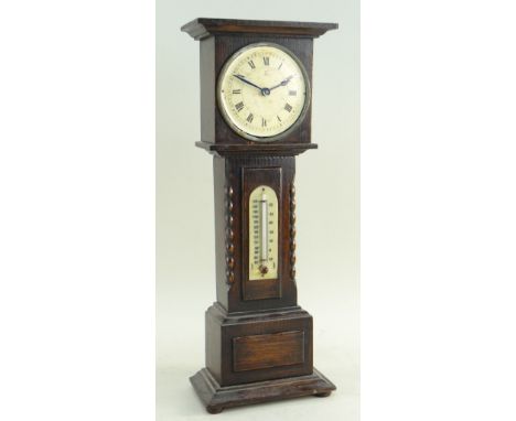 VINTAGE TIMEPIECE &amp; THERMOMETER, modelled as an oak longcase clock, 40cms high Condition Report: hood loose, bears manufa