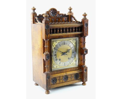 EARLY 20TH CENTURY ARTS &amp; CRAFTS-STYLE OAK MANTEL CLOCK with silvered Roman chapter ring and applied angel spandrels, 8-d