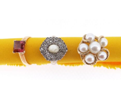 THREE LADIES DRESS RINGS comprising yellow metal pearl set ring of naturalistic claw design (9.3gms), yellow metal diamond an