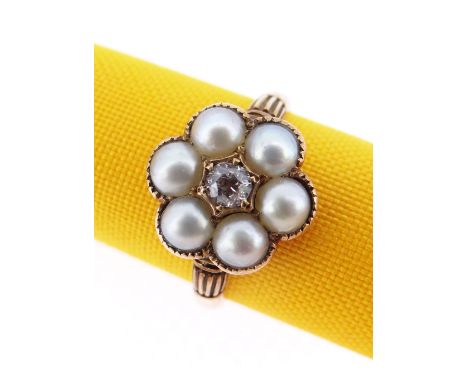 18CT GOLD DIAMOND &amp; PEARL RING of flower head design with central old European cut diamond (0.15cts approx.) surrounded b