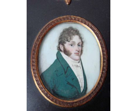 A 19th century Portrait Miniature on ivory depicting a gentleman in a green overcoat, half length, oval in brass mounted ebon