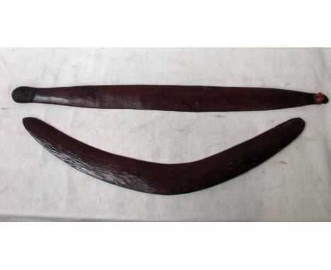 Tribal Interest, an Aboriginal Boomerang of typical form, adze carved with domed top surface and flat underside, 62cm long an