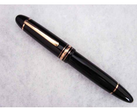 A Mont Blanc Meisterstuck Fountain Pen, model number 149, black case with gilt metal fittings and 18ct white and yellow gold 