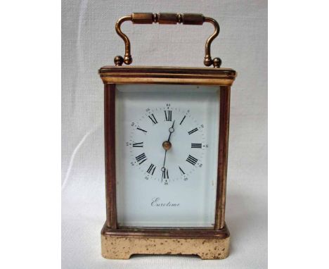 A large brass framed French Carriage Clock, five bevelled glass panes, white enamel dial with Roman numerals, signed Eurotime