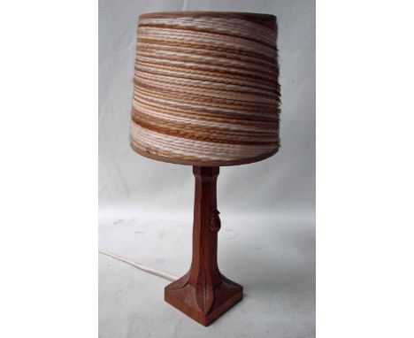 Robert 'Mouseman' Thompson of Kilburn, an oak Table Lamp, octagonal tapering column with carved leaf decoration on square bas