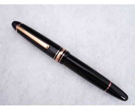A Mont Blanc Meisterstuck ball Point Pen, black and gilt metal mounted case with screw on cap, white star end caps, roller ba