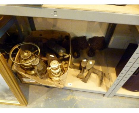 Shelf of mixed items including cast iron bath feet. shoe last and storm lanterns 