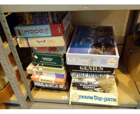 Shelf of mixed games & puzzles