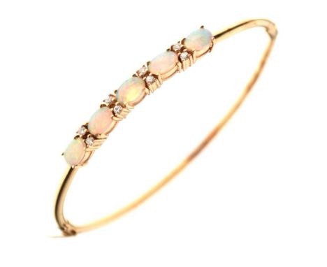 Yellow metal, opal and diamond set hinged bangle, stamped '14kt', 7.1g gross approx