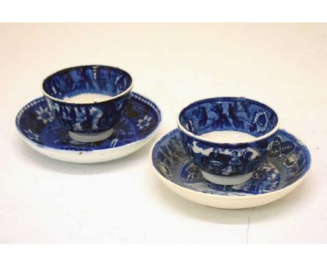 Pair of early 19th Century blue and white pearlware tea bowls and saucers transfer printed with scenes of tea parties